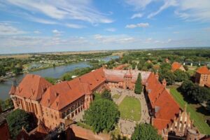 From Gdansk: Malbork Castle Trip with Ticket and Audio Guide - Gdańsk hotel pickup and the hour-long ride that sets the tone